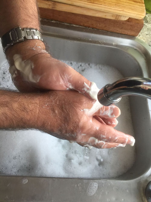 Wash hands with cold water